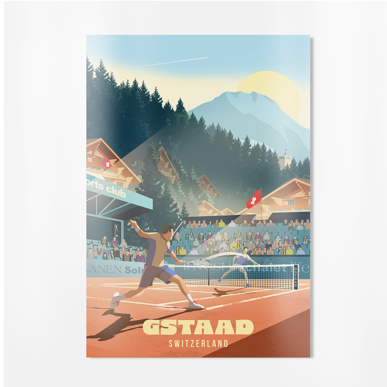 A travel-style poster print showing a tennis match at an outdoor court in GSTAAD, Switzerland, with mountains, trees, chalets, spectators, and a large yellow sun in the sky. The text 'GSTAAD SWITZERLAND' appears at the bottom.